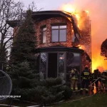 Ukrainian firefighters tackle a blaze after a residence was damaged by a Russian missile attack in Dnipro on Thursday.